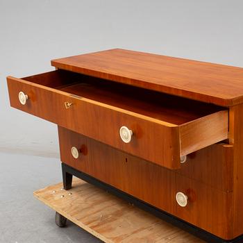 A walnut veneered chest of drawers, 1930's.