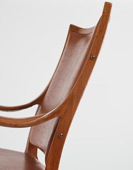 Hans Asplund, a walnut and leather easy chair, Nordiska Kompaniet, ca 1955, for the Nordiska Kompaniet beauty salon.