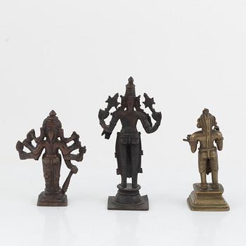 A group of three Indian bronze figures and an ewer, 20th century.