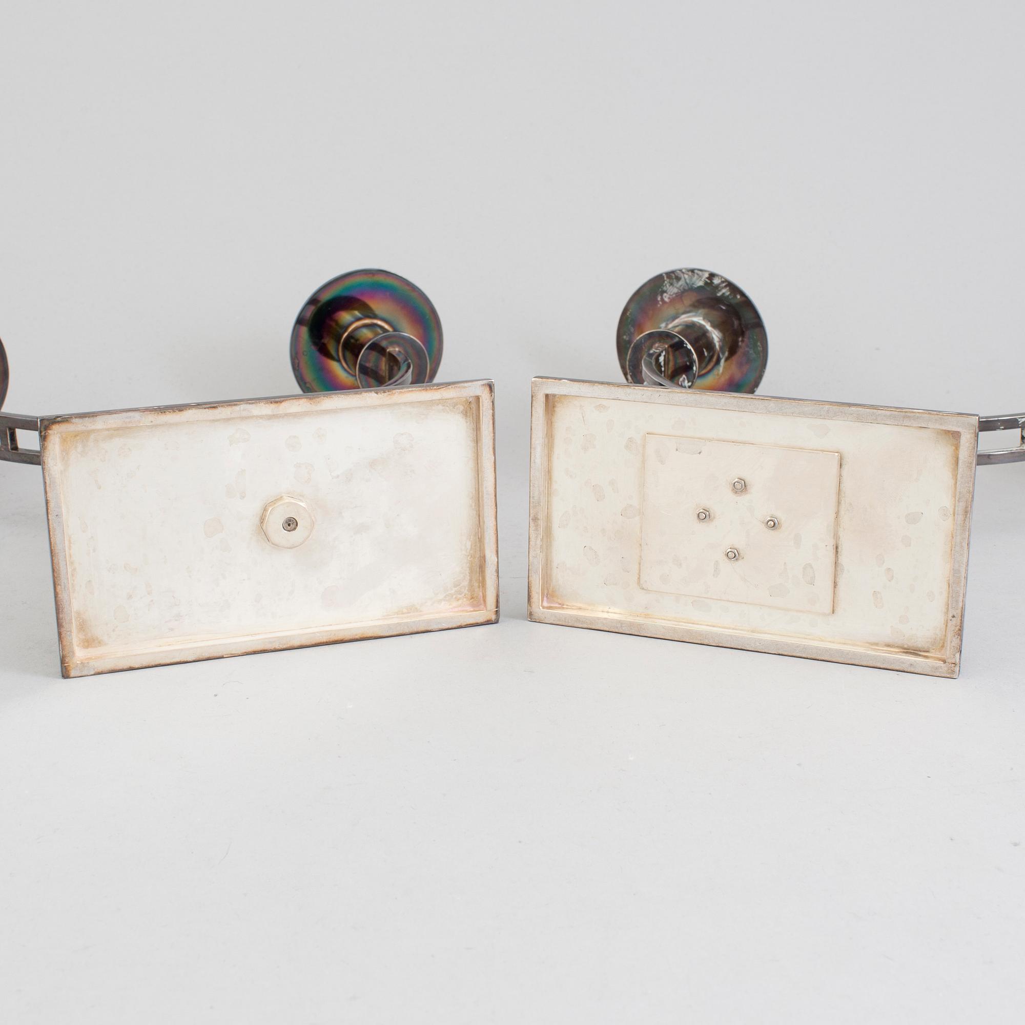 A pair of Klas-Göran Tinbäck two light sterling silver candelabra. Stockholm, 1989.