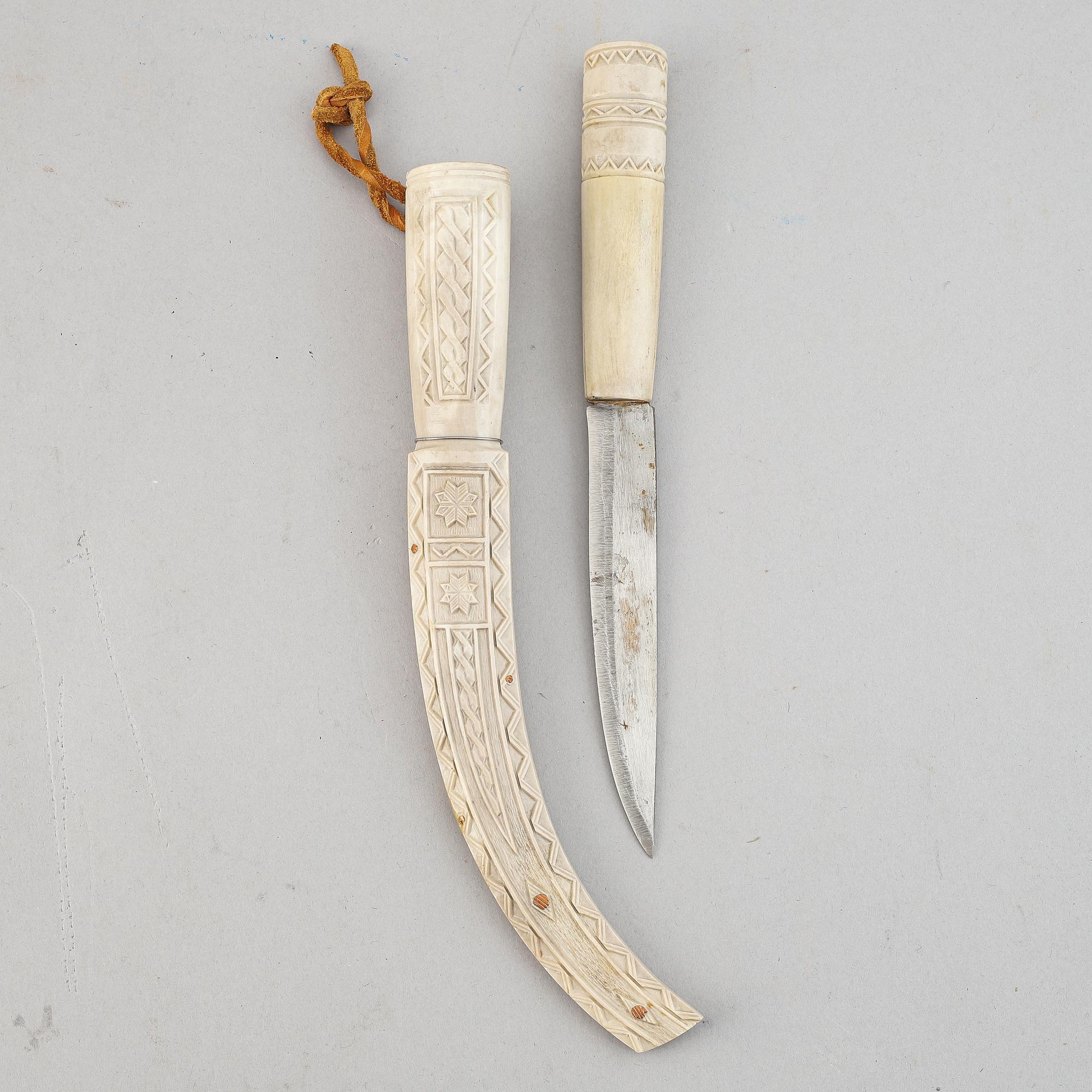 A reindeer horn Sami knife, signed SJ.