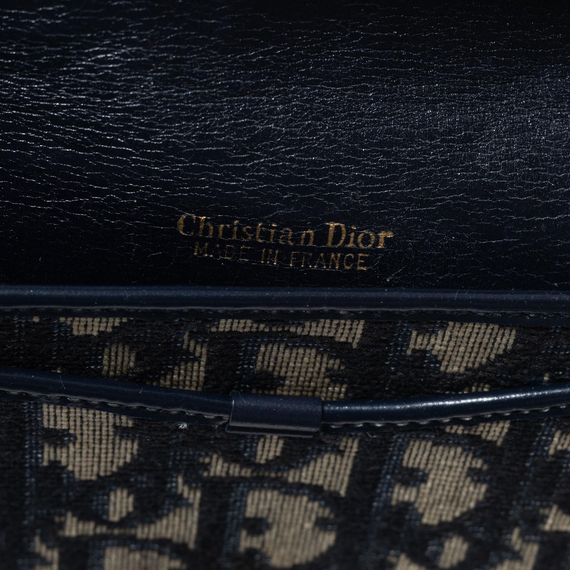 Christian Dior, a clutch and a scarf.