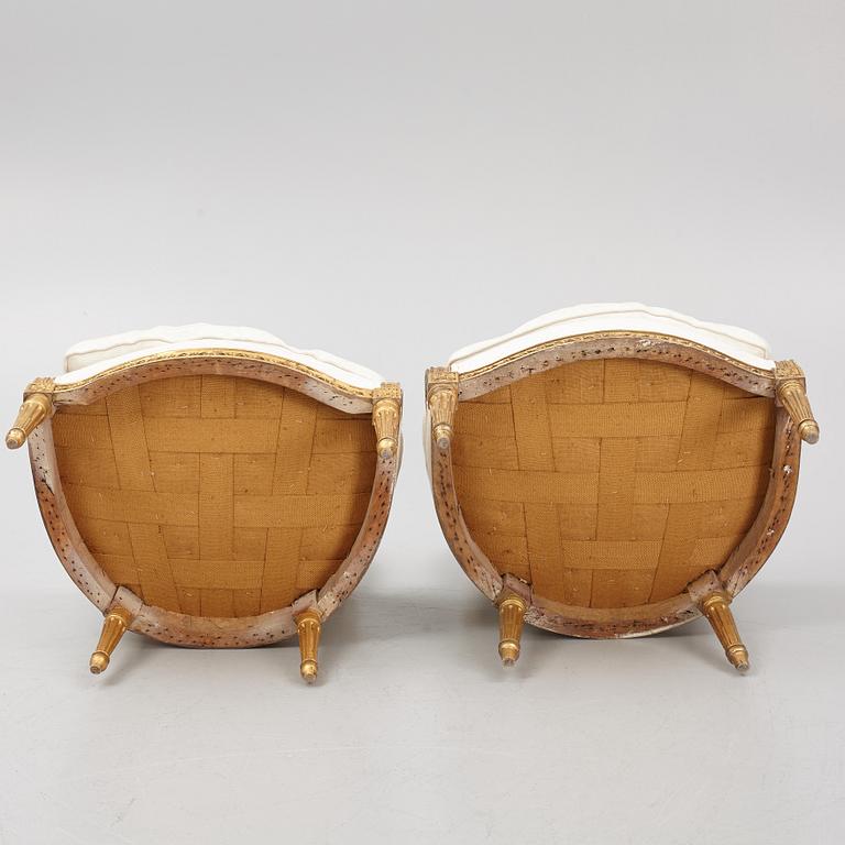 A near pair of French Louis XVI giltwood bergères, Paris, late 18th century.