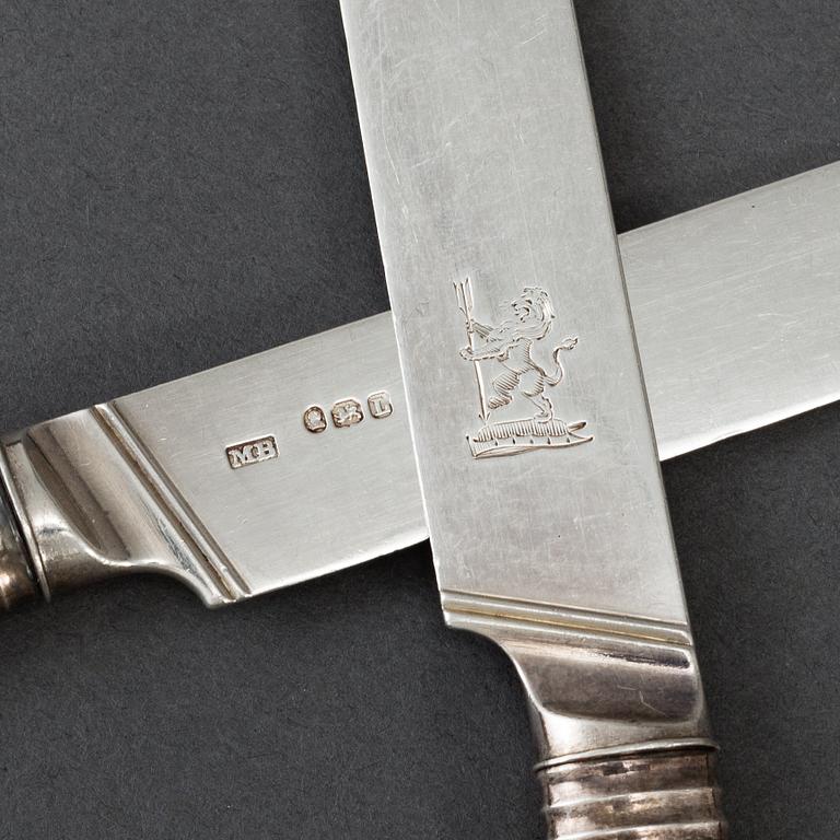 An English set of ten early 19th century silver and mother of pearl chees /fruit knifes.