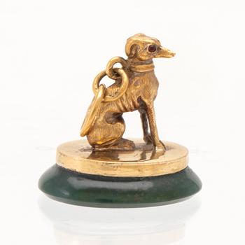 An 18K gold seal/pendant with green stone.