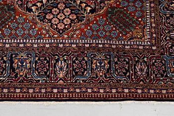 A rug, semi-antique Kashan, ca 216,5 x 140 cm.