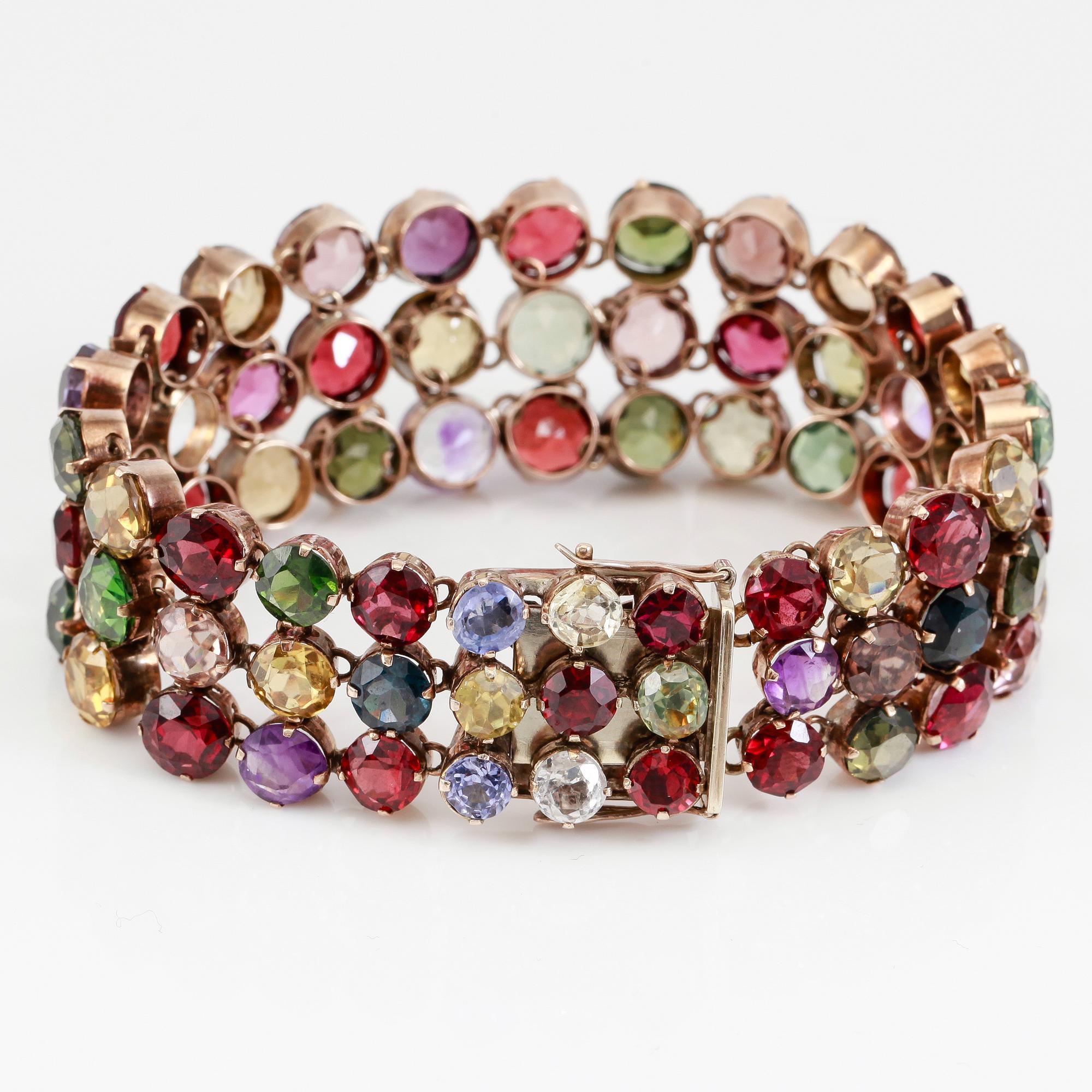 ARMBAND, förgyllt silver och olika stenar, bl a ametister, granater, citriner och syntetiska spineller.