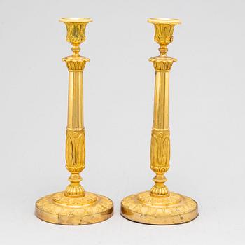 A pair of French Empire candlesticks, early 19th century.