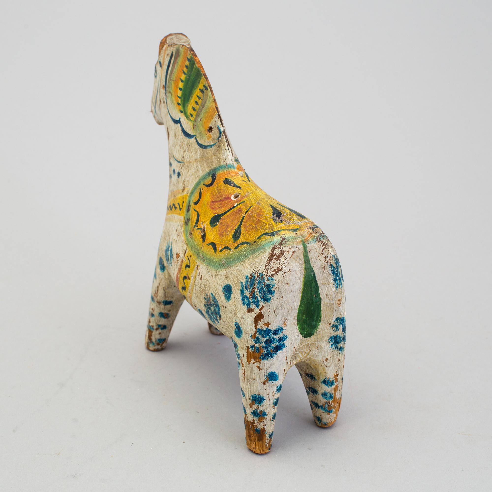 A painted folk art dala horse first half of the 20th century.