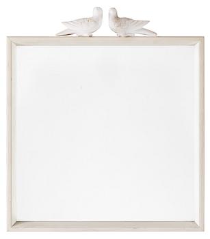 An Estrid Ericson wooden framed mirror with a pair of alabaster pigeons by Svenskt Tenn.