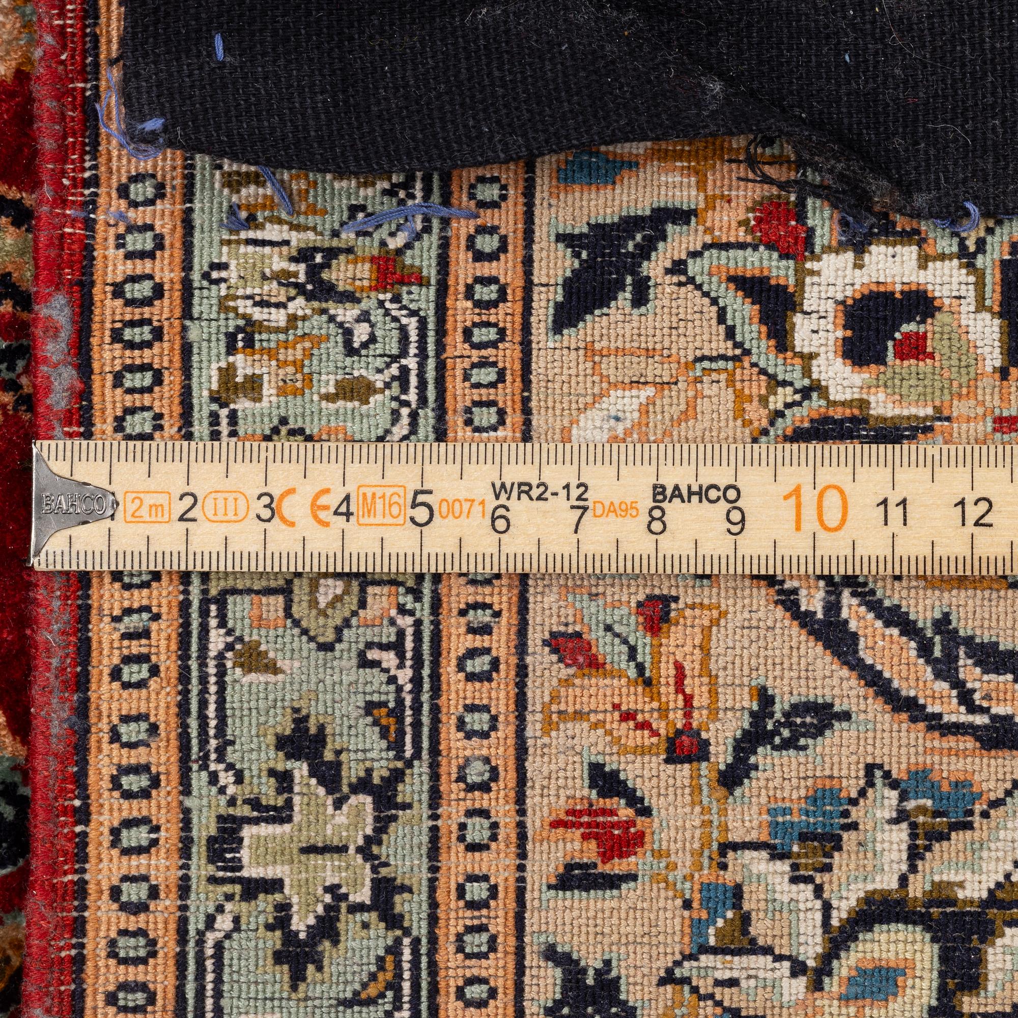 A silk Kashmir rug, c. 176 x 121 cm.