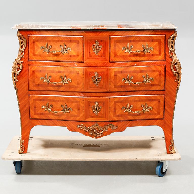 A rococo style chest of drawers, around the mid 20th century.