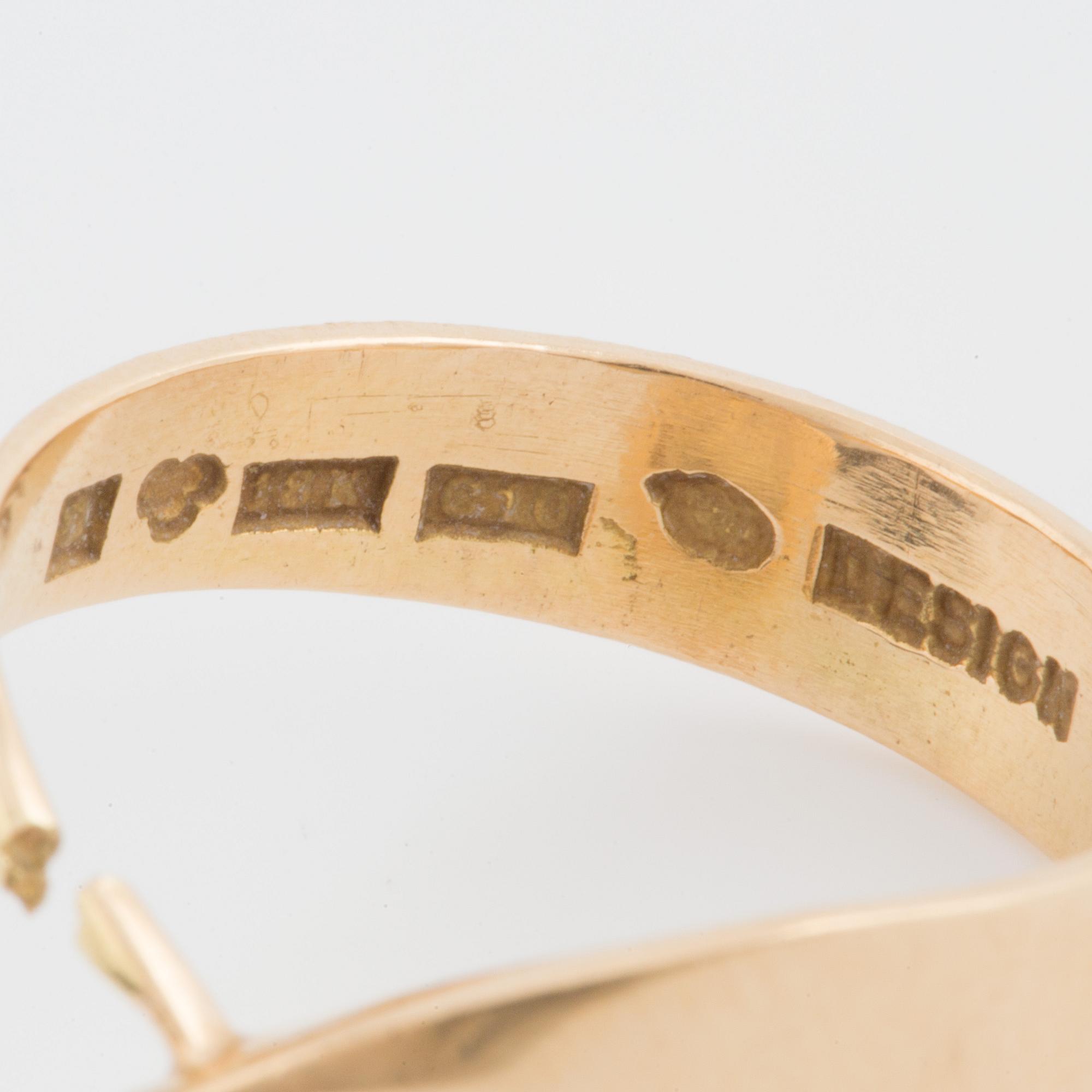 A ring set with an octagonal, step-cut citrine.