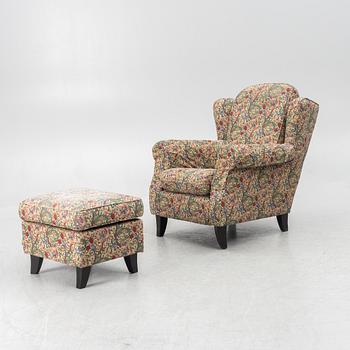 A "Djursholm" armchair with ottoman, Sweden, early 21st century.