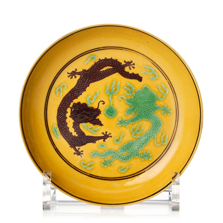 A yellow ground dragon dish, Qing dynasty with Guangxu six character mark and period (1875-1908).