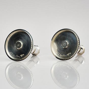 Wiwen Nilsson, a pair of sterling silver candlesticks, Lund, Sweden 11957 and 1960.
