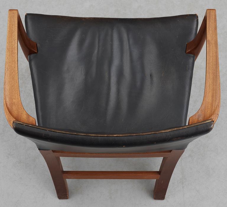 A Kaare Klint mahogany and black leather armchair by Rud Rasmussen snedkerier, Denmark.