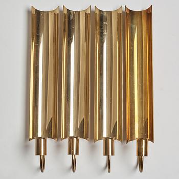 A set of four 'Reflex' brass wall scones by Pierre Forsell, Skultuna.