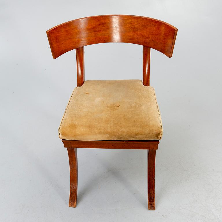A set of four mahogany chairs around 1900.