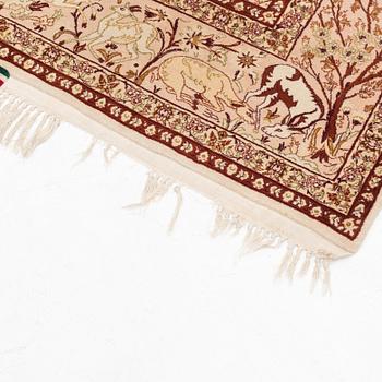 A signed part silk Esfahan rug, ca 233 x 147 cm (as well as 3 cm flat weave on each side).