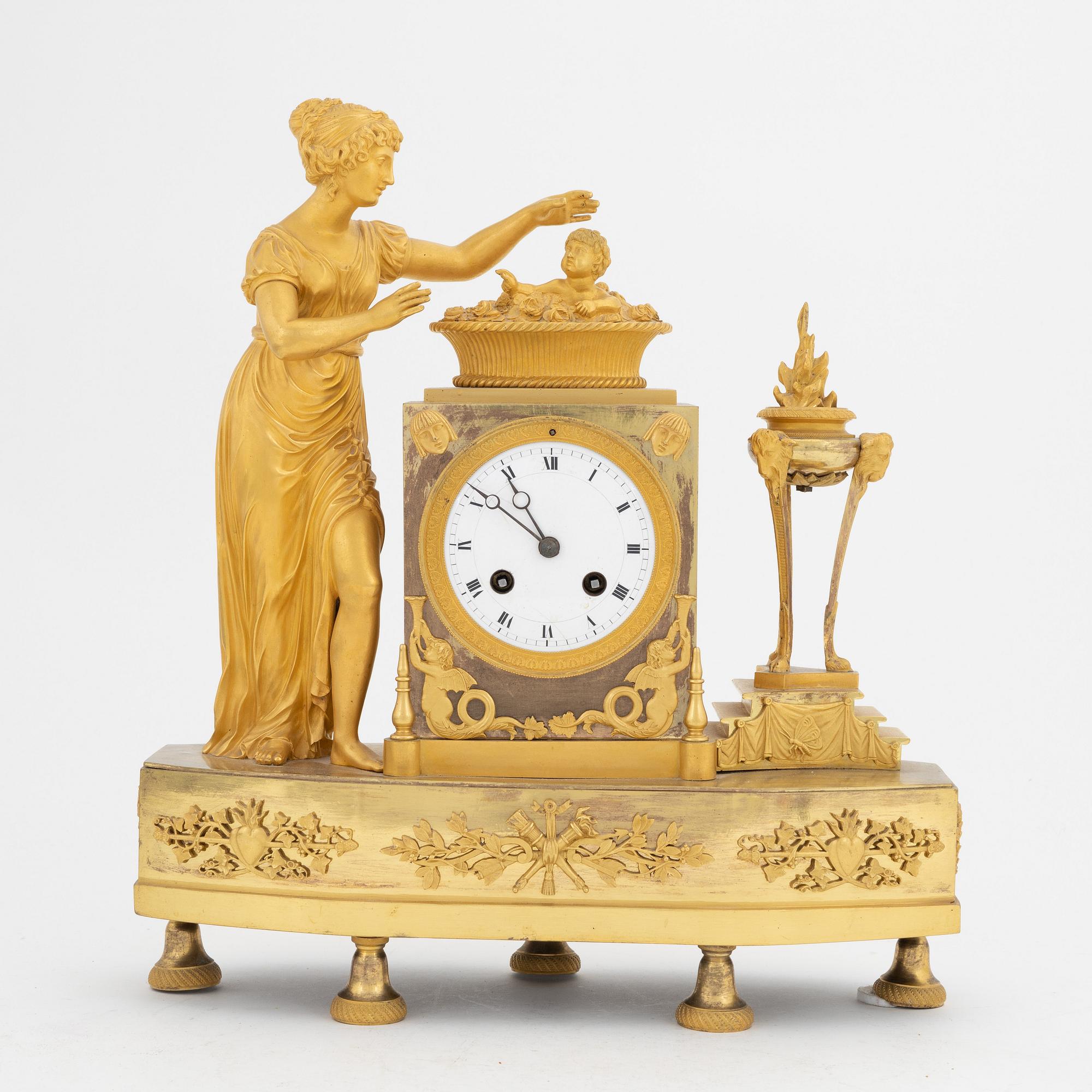 A French Empire gilt bronze mantle clock, early 20th Century.