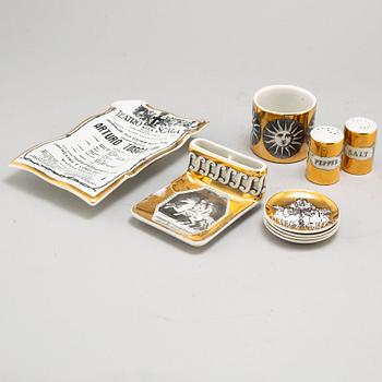 PIERO FORNASETTI, 9 parts, including 5 ashtrays, one plate, one vase and salt and peppercellars, Italy, 1950's -.