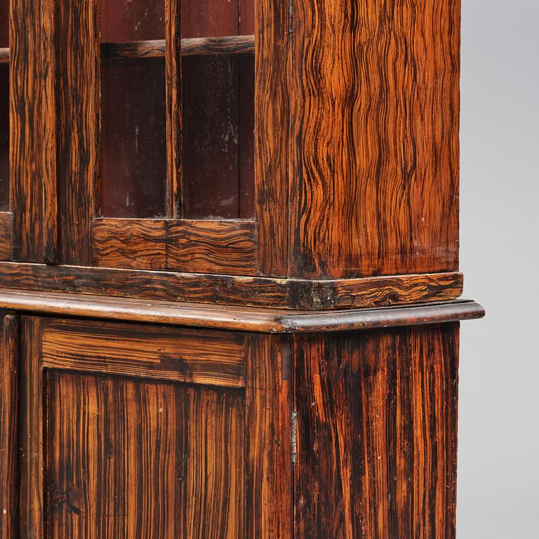 A Swedish faux-boix neo-gothic book cabinet, ca 1830.