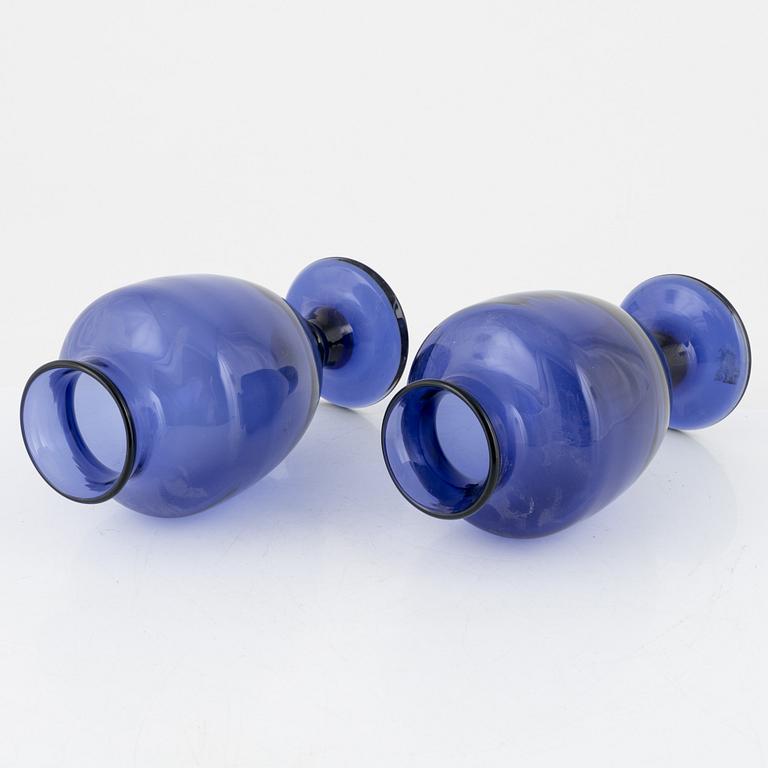 A matched pair of blue glass vases from around the year 1900.