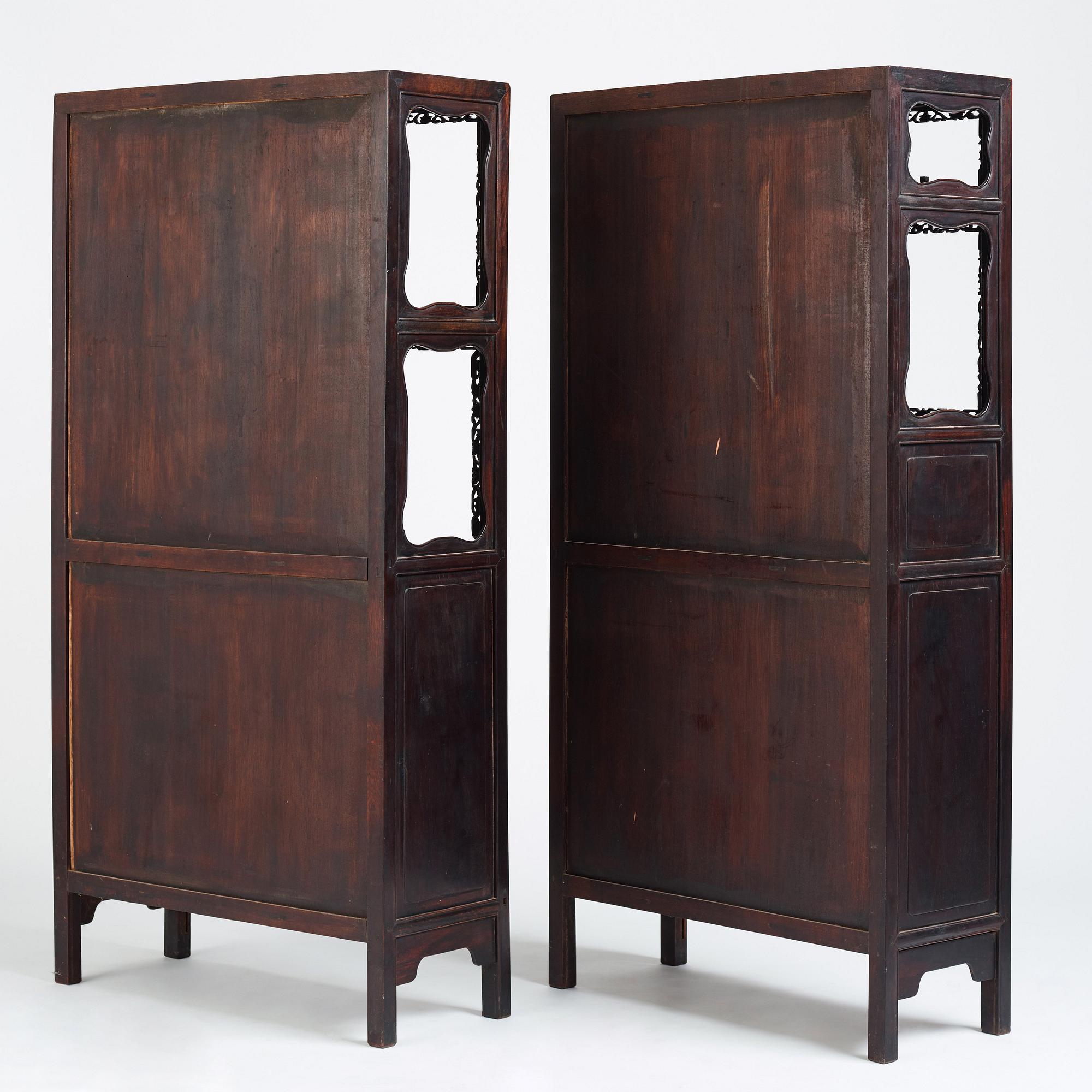 A pair of Chinese hardwood display cabinets, Qing dynasty, 19th Century.