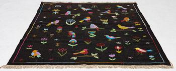 A hand-embroidered Kelim rug, 204 x 150 cm.