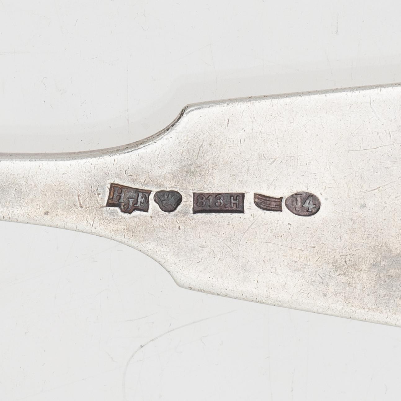 A silver server and six spoons, marks of Grachev, St Petersburg, and Helsingfors Juvel- och Filigranab, respectively.