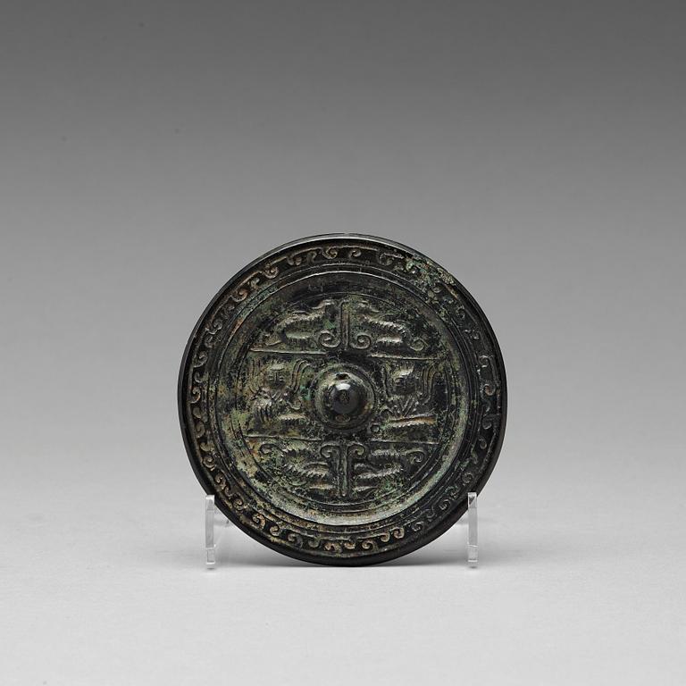 A bronze mirror, presumably Han dynasty (206 B.C - 220 A.D).