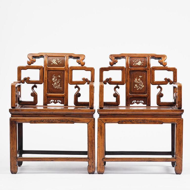 A pair of hardwood armchairs, late Qing dynasty.
