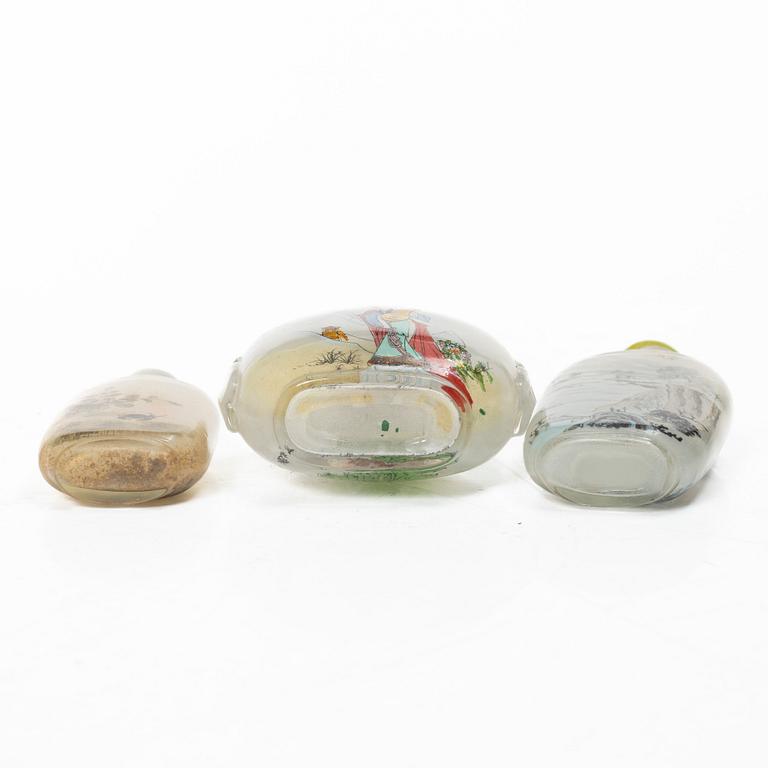 A group of three Chinese glass snuffbottles, 20th century.