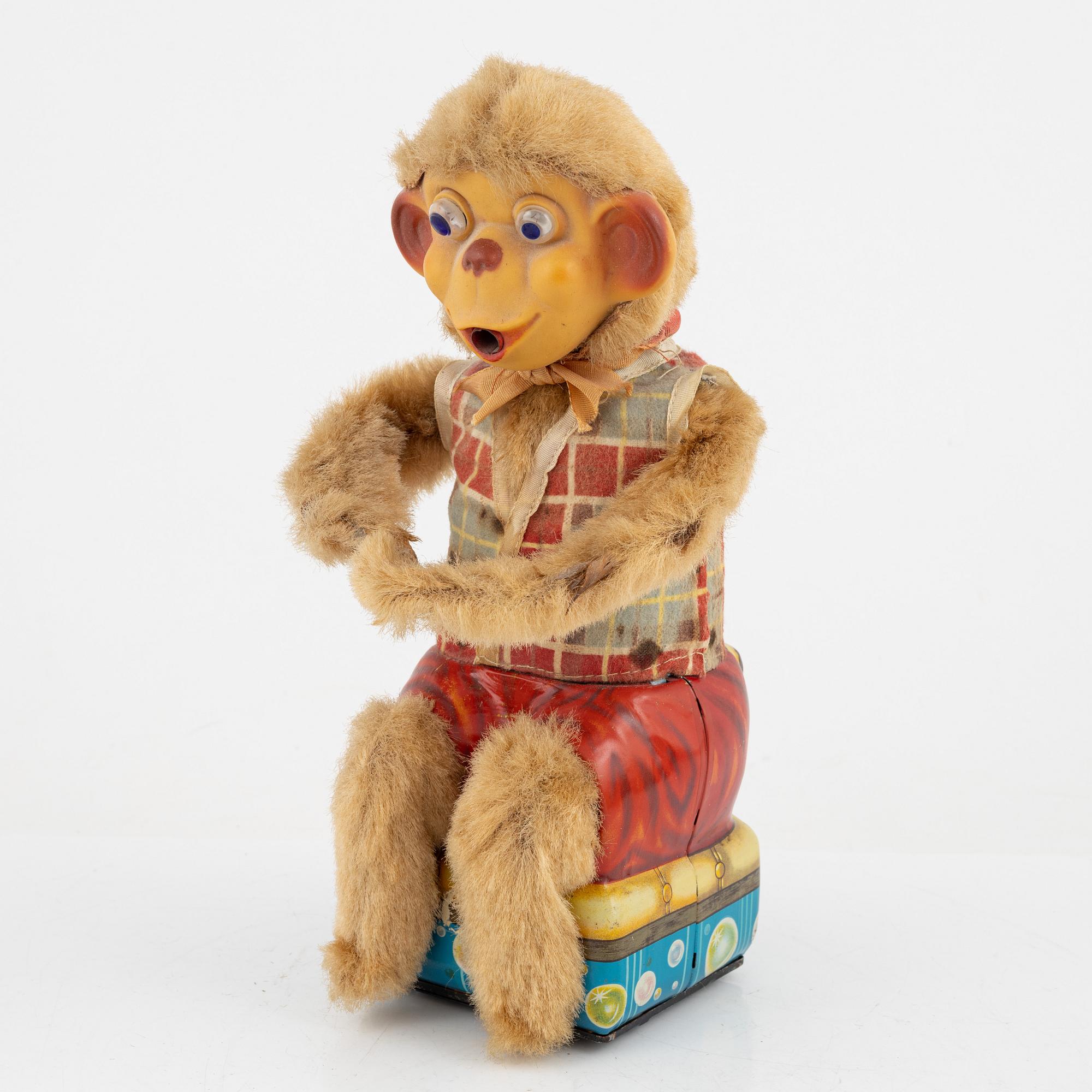 A set of five toys, including 'Rolly' clown from Schuco, 20th century.