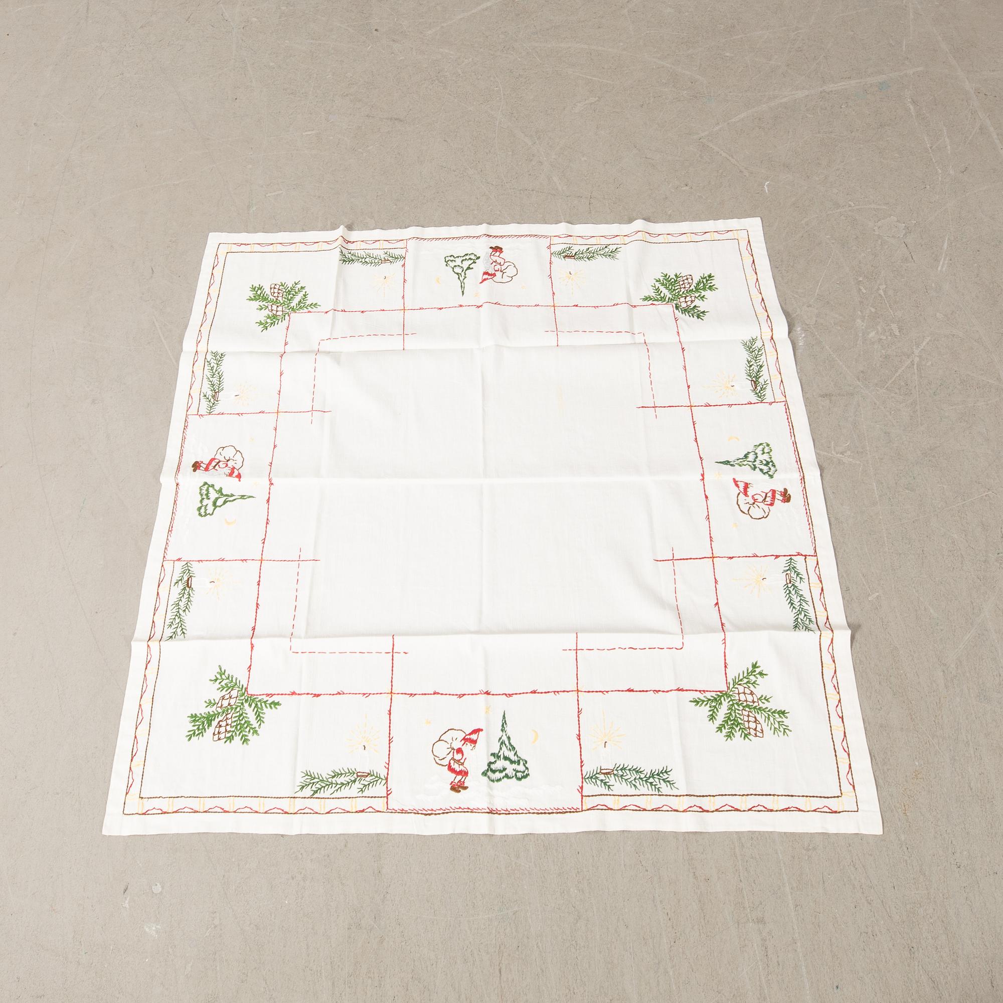 A collection of Christmas tablecloths 12 pcs first half/mid 20th century.