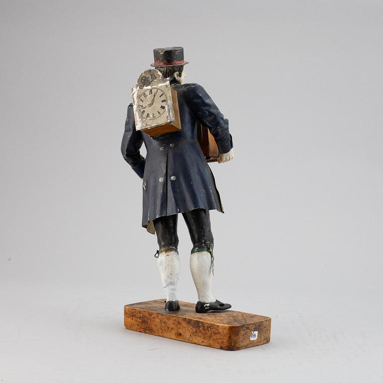 A Black Forest sheet metal figural timepiece, second half of the 19th century.