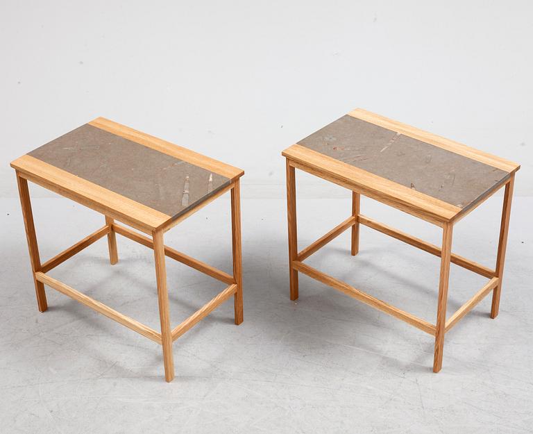 A pair of of oak and limestone tables, 21th century.