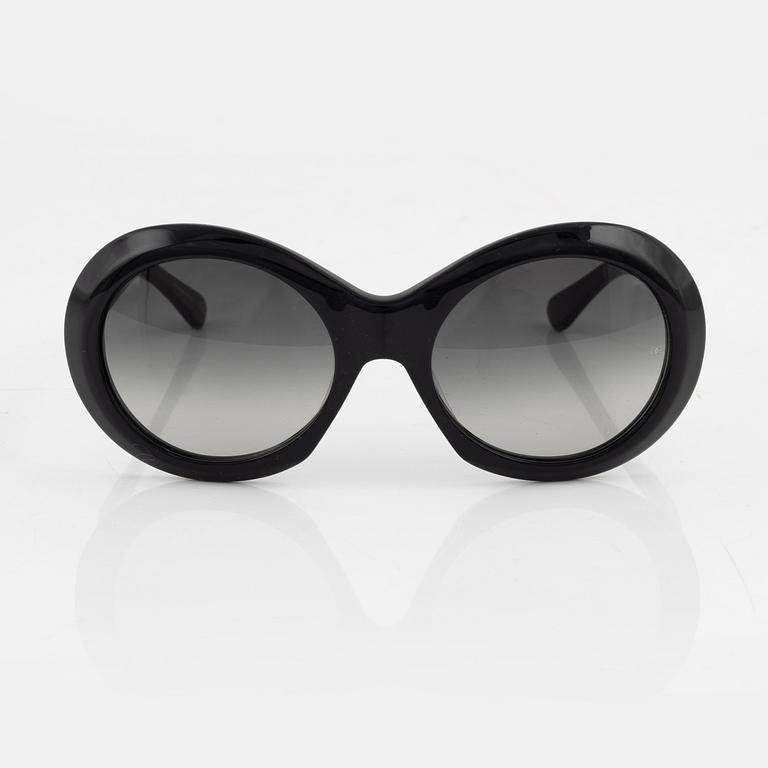 Oliver Goldsmith, a pair of black "Audrey" sunglasses.