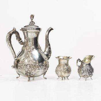 A silver Rococo style coffee pot, creamer and sugar bowl, Swedish import mark of Gewe Silvervarufabriken Ab, Malmö, 1977.