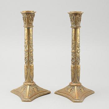 A pair of brass candlesticks from Elkingtons in Birmingham, 19th century.