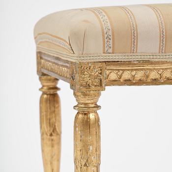 A near pair of late Gustavian giltwood stools, one by J. Hammarström (master in Stockholm 1794-1812).