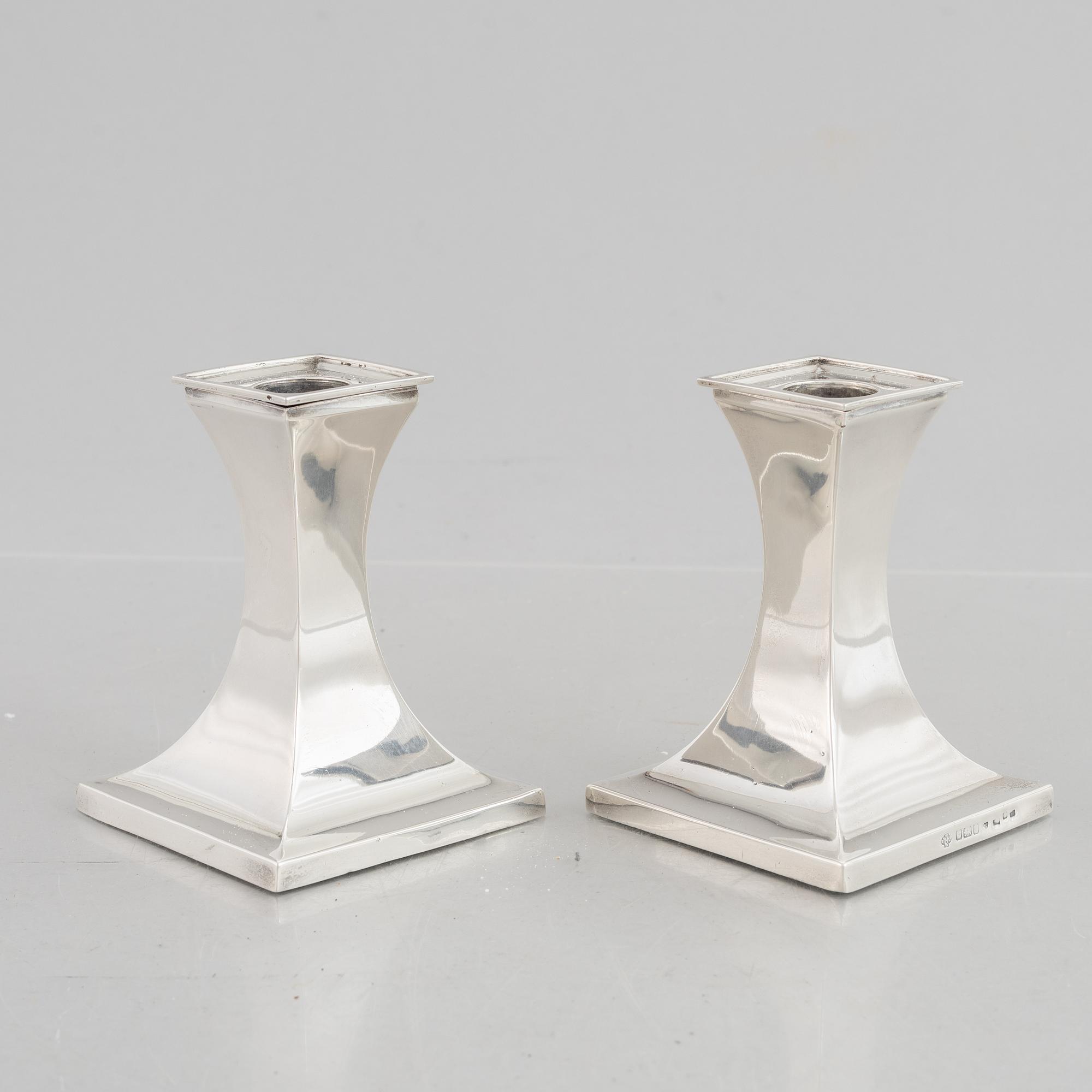 A pair of silver candlesticks, mark of William Hutton & Sons Ltd, Sheffield 1911-1912.