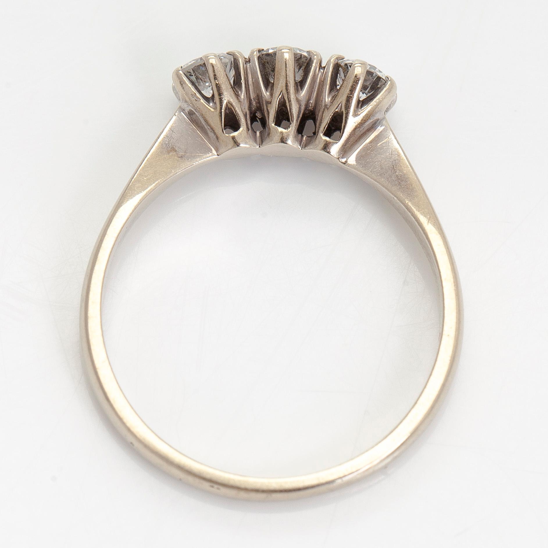 Ring, three brilliant cut diamonds, 18K white gold, H. Lahtinen & Co., 1985.