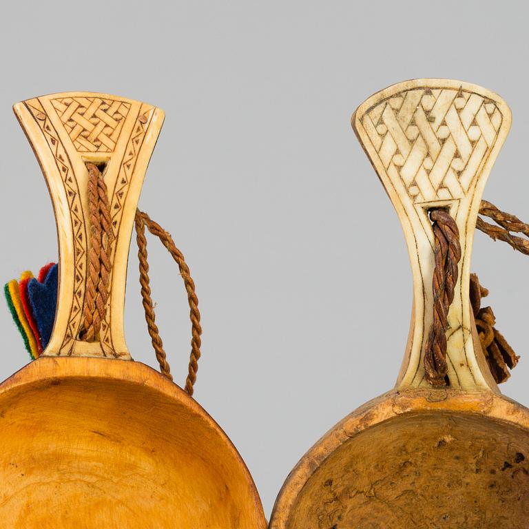 A set of five amongst others Sami cups made of birchwood and reindeer antlers.