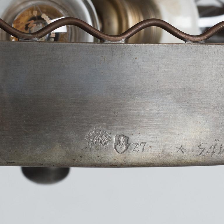 Firma Svenskt Tenn, a pewter and brass chandelier, Stockholm 1926.