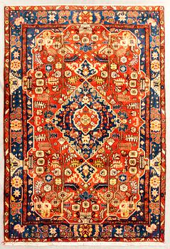 Oriental semi-antique rug, approximately 302x197 cm.