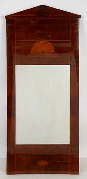 An Empire mirror, first half of the 19th Century.