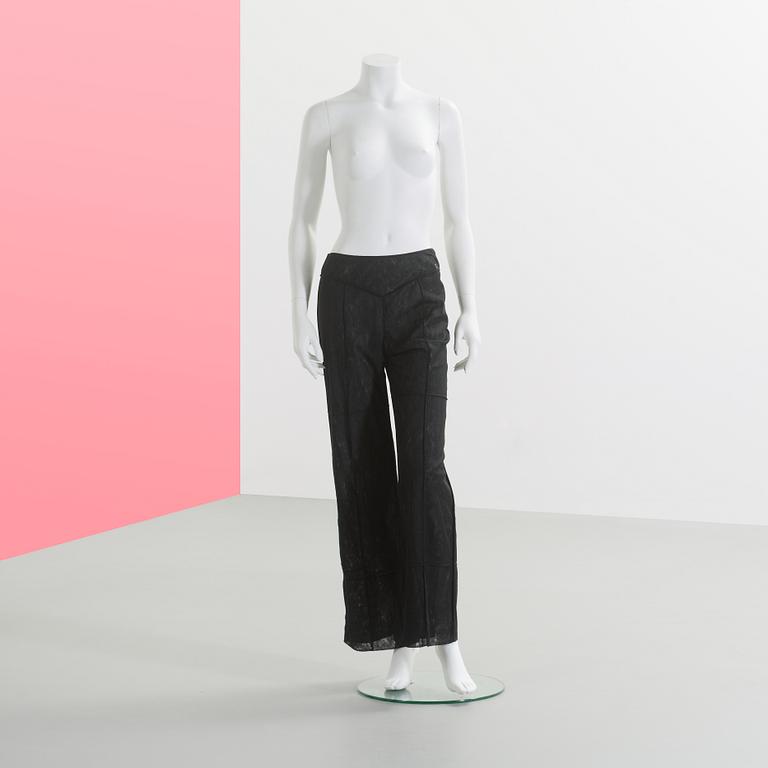 CHANEL, a black mesh evening pant.