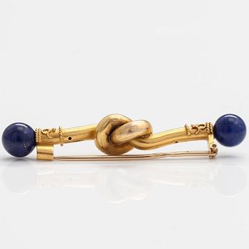 An 18K gold brooch, needle 14K gold, with lapiz lazuli.